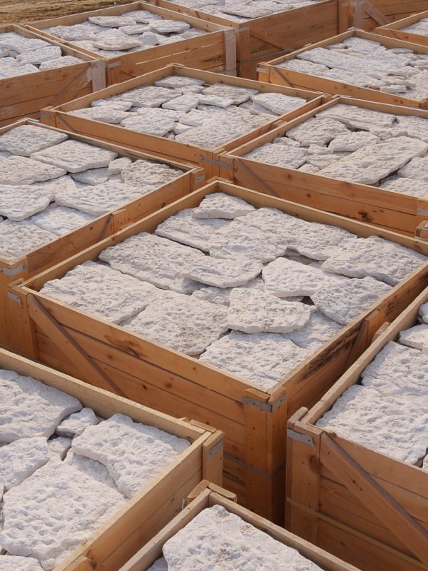 Loading marble crates into shipping container for export