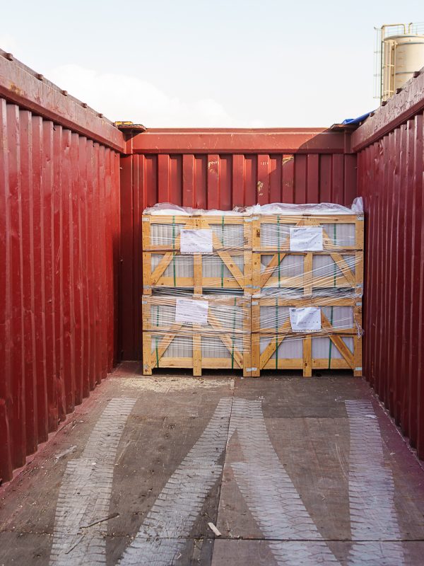 Loading marble crates into shipping container for export